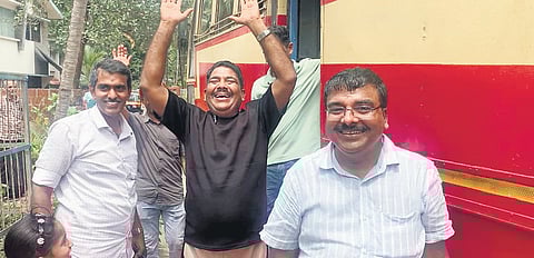 Friends and relatives receive Gafoor outside the Karipur airport with a rented KSRTC bus to pick him up