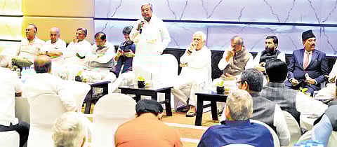 CM Siddaramaiah addresses the CLP meeting, as senior party colleagues DK Shivakumar, Dr G Parameshwara, RV Deshpande, KJ George, Saleem Ahmed, and KH Muniyappa, among others, look on in Bengaluru on Tuesday.