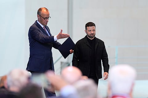 Germany's Chancellor Friedrich Merz, left, and Ukraine's President Volodymyr Zelenskyy arrive for a news conference at the chancellery in Berlin, Germany, May 28, 2025.