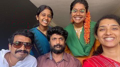 Gouri Padmakumar (standing left) and Sruthy Vijayan (standing right), who acted as Shubha and Thanu respectively in the web series 'The Hunt', with part of the cast of the OTT hit.  