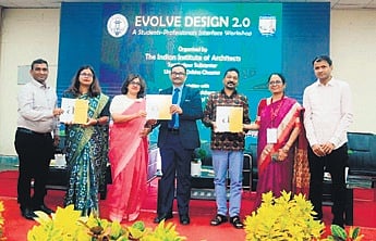 VSSUT V-C Dipak Kumar Sahoo and other dignitaries releasing a book on architectural designs during the event.