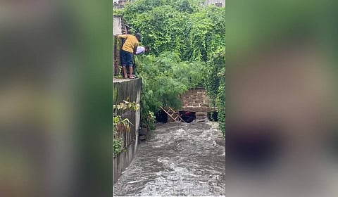 HYDRAA team rescues a man from a nala near Yakutpura Railway Station in the Old City of Hyderabad on Wednesday