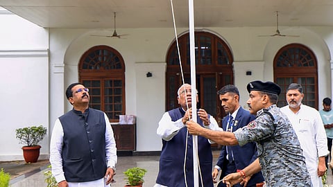 Congress President Mallikarjun Kharge unfurls the national flag during the 79th Independence Day celebration in New Delhi, Aug. 15, 2025. 