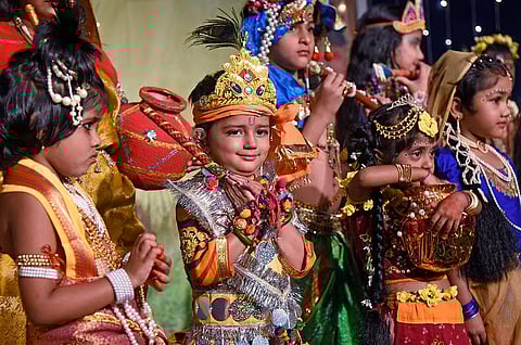 Children dressed as Lord Krishna and Radha participate in the costume contest held on the occasion of Krishna Janmashtami