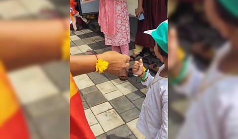 The issue began when photos of BJP leaders tying rakhi in the hands of anganwadi children surfaced on social media. 