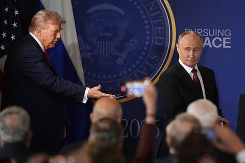 President Donald Trump, left, and Russia's President Vladimir Putin arrive for a joint press conference at Joint Base Elmendorf-Richardson, Alaska, Friday, Aug. 15, 2025.