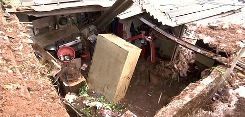 Soil and stones from a nearby hillock collapsed on a hut