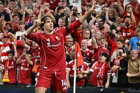 Liverpool's Italian striker Federico Chiesa celebrates scoring their third goal during the English Premier League football match between Liverpool and Bournemouth at Anfield in Liverpool, north west England on August 15, 2025.