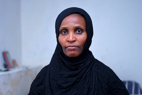 Senait Tadesse, who her 27-year-old daughter made it to Yemen, only to be held captive by kidnappers, poses for a photo at her home in Addis Ababa, Ethiopia.