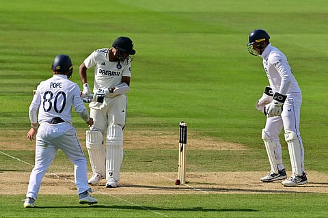 India's Mohammed Siraj (2L) can only watch as a ball from England's Shoaib Bashir spins back onto his stumps as England's Ollie Pope (L) and England's Jamie Smith (R) look on.