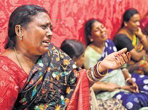 Relatives mourn their loved ones who died in the Ramanthapur tragedy