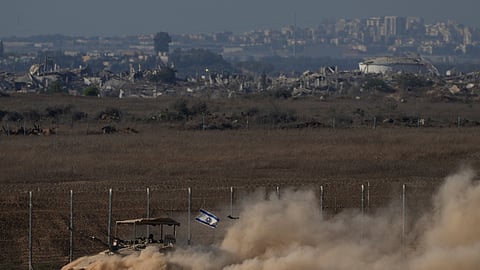An Israeli tank moves on an area near the Israeli-Gaza border, as seen from southern Israel, Monday, Aug. 18, 2025.