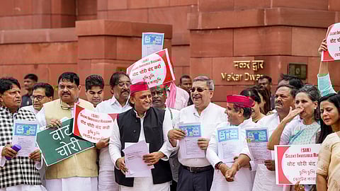 Samajwadi Party MPs Akhilesh Yadav and Dharmendra Yadav, TMC MP Kalyan Banerjee and other parliamentarians from the INDIA bloc parties stage a protest against the Election Commission's Special Intensive Revision (SIR) of electoral rolls in Bihar, during the Monsoon session of Parliament, in New Delhi, Monday, Aug. 18, 2025