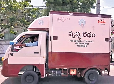 People receiving groceries for dry wastes at Swachha Ratham, a pilot project launched by Swachh Andhra Corporation in Guntur Rural mandal. 