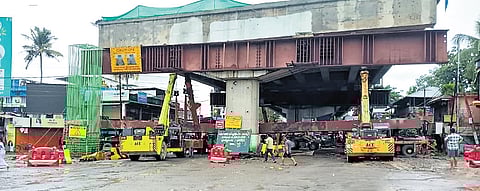 The steel beam that collapsed while being lifted onto girders as part of the construction of elevated highway on NH 66 at Thuravoor on Sunday.