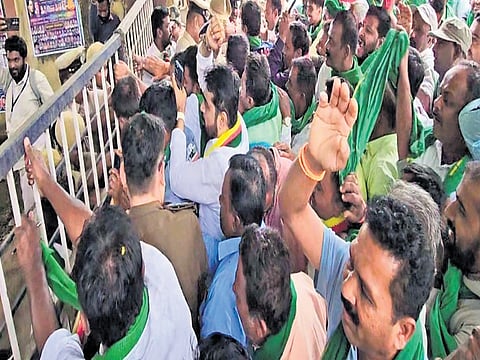 Farmers protest outside the Anekal taluk office on Tuesday.