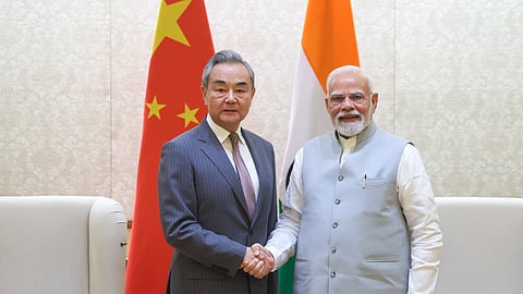 Prime Minister Narendra Modi with Chinese Foreign Minister Wang Yi during a meeting in New Delhi, Aug. 19, 2025.