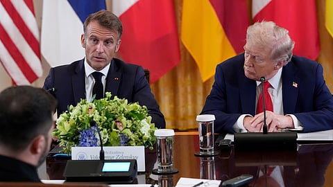 France's President Emmanuel Macron speaks as President Donald Trump, right, listens during a meeting with Ukrainian President Volodymyr Zelenskyy and European leaders in the White House on  Monday.