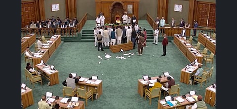 Congress MLAs not only ripped up the day's agenda but also tossed it into the air before staging a sit-in in the Well of the House. 