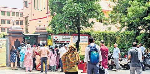 People gather outside DPS Dwarka that received a threat on Monday