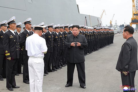 North Korean leader Kim Jong Un, center, inspects the warship Choe Hyon in Nampo, North Korea, on Aug. 18, 2025.