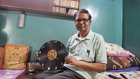 A Murugan with a clock made of a vinyl record
