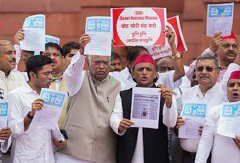 Parliamentarians from the INDIA bloc parties stage a protest against the Election Commissions Special Intensive Revision (SIR) of electoral rolls in Bihar, during the Monsoon session of Parliament, in New Delhi.