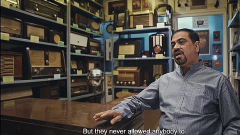 A still from the film showing Uday Kalburgi at his radio museum  