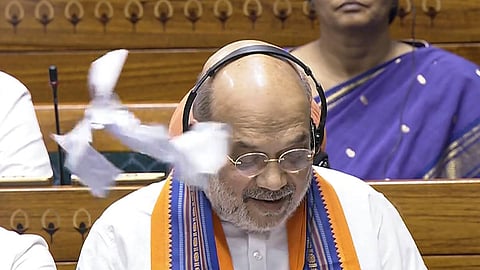  Union Home Minister Amit Shah speaks in the Lok Sabha amid protest by opposition members during the Monsoon session of Parliament, in New Delhi, Wednesday, Aug. 20, 2025. 