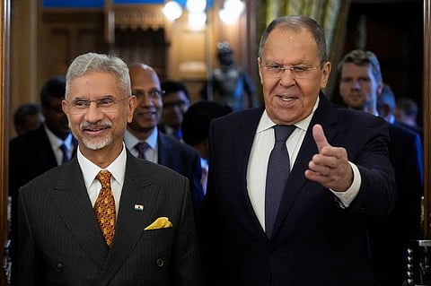 Russia's Foreign Minister Sergey Lavrov, right, and EAM Subrahmanyam Jaishankar enter a hall for their talks at Zinaida Morozova's Mansion in Moscow, Russia, Thursday, Aug. 21, 2025.