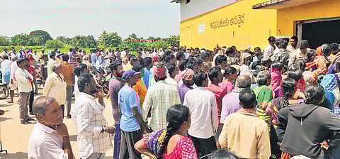 Farmers gather at the Primary Agricultural Cooperative Society at Kothapalli in Gambhiraopet mandal of Rajanna-Sircilla district on Friday