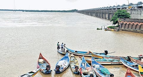 Boats anchored as level rises at Dowleswaram Barrage on Thursday.