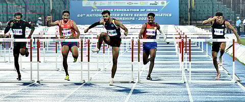 Tejas Shirse leads the pack during the men's 110m hurdles final on Friday