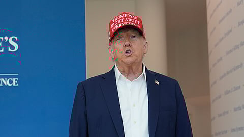 President Donald Trump speaks with reporters at The People's House museum. Friday, Aug. 22, 2025, in Washington.