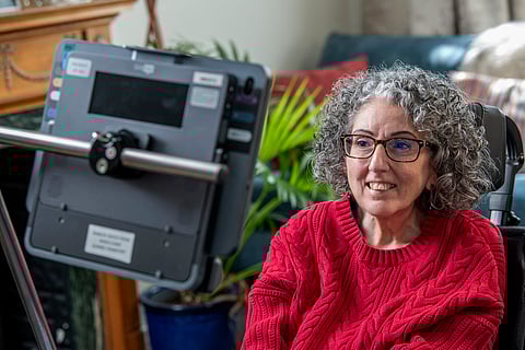 This handout image released by Smartbox Assistive Technology shows Sarah Ezekiel at her home in Hendon, north London,