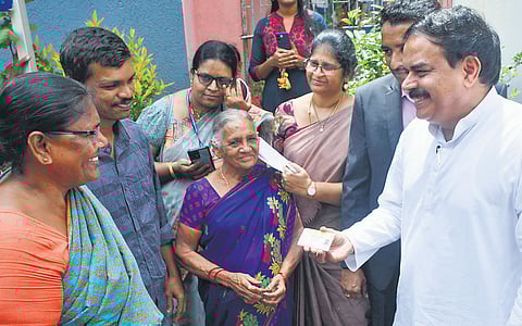Civil Supplies Minister N Manohar distributes new ration cards to people in Vijayawada 