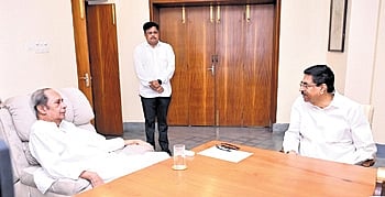 Odisha Governor Hari Babu Kambhampati speaking with Naveen at Naveen Niwas