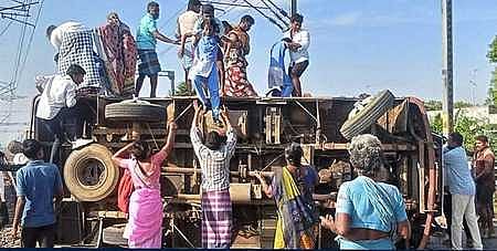 Local people removing injured students from the school van which overturned at the Madurai–Dhanushkodi National Highway on Tuesday, February 24, 2026