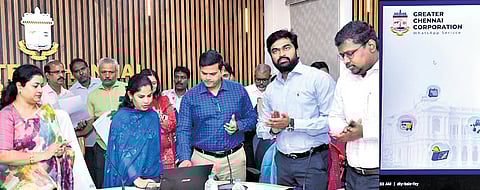 Mayor R Priya launching the WhatsApp-based chatbot and QR code system on Monday. 