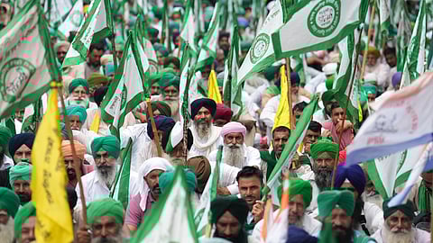 Farmers attend a 'Kisan Mahapanchayat' organised by the Samyukt Kisan Morcha, at Jantar Mantar, in New Delhi, Monday, Aug. 25, 2025.