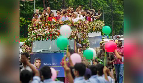 Group Captain Shubhanshu Shukla with his wife Kamna and others during a victory parade as he is welcomed after his historic mission to the International Space Station (ISS), in Lucknow, Monday, Aug. 25, 2025. 