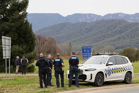 Police wait near the scene of a shooting in the high country of Porepunkah in the state of Victoria, Australia, Tuesday, Aug. 26, 2025.