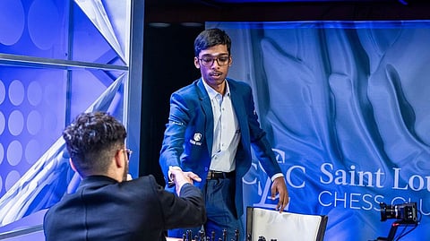 Indian Grandmaster R Praggnanandhaa shakes hands with Alireza Firouzja of France at the Sinquefield Cup chess tournament in St. Louis, Missouri, USA, on Tuesday, Aug. 26, 2025.