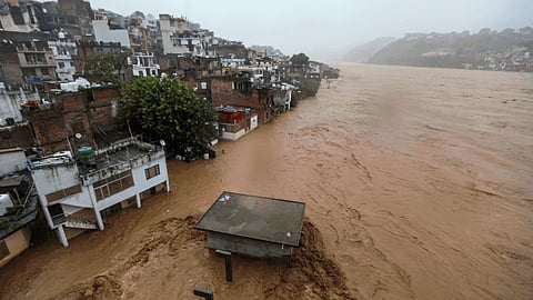 Rivers overflowed, the raging waters flattening everything in their way, and boulders, trees and rocks hurtled down slopes across Jammu region, killing at least 13 people, including nine pilgrims struck by a landslide on the Vaishno Devi route.