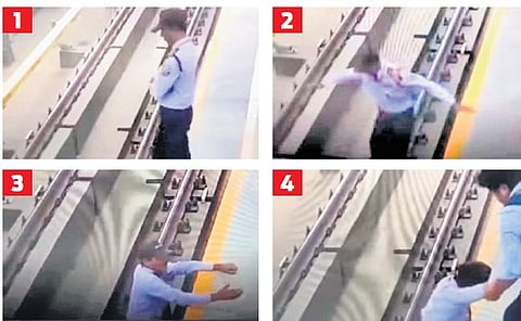 CCTV footage shows the guard falling onto the Metro tracks and being pulled to safety
