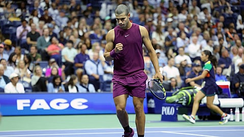 Spain's Carlos Alcaraz gestures after a point won against Italy’s Mattia Bellucci during their men's singles second round tennis match on day four on August 27, 2025. 