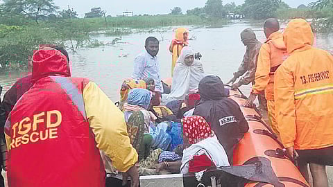 Personnel from Banswada fire station rescue people from Sirpur village, Kamareddy district.