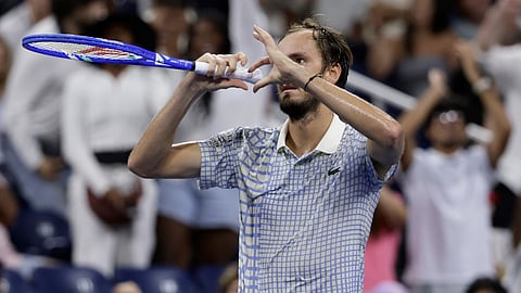 Daniil Medvedev, of Russia, gestures after a photographer ran onto the court during a match against Benjamin Bonzi, of France, in the first-round of the U.S. Open tennis championships, Sunday, Aug. 24, 2025, in New York.