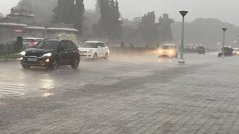 Vehicles wade their way through rains in Bengaluru.