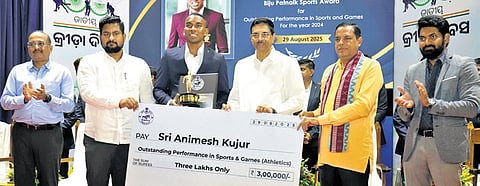 Governor Hari Babu Kambhampati presenting the Biju Patnaik Sports Award to Animesh Kujur at Jaydev Bhawan in Bhubaneswar on Friday | Shamim Qureshy